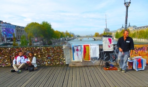 Lovers frolick at the Lover's Bridge aside a dreamer. Only a few months later the Parisians fell out of love and began the removal of the padlocks, what does this mean for those lovers who locked their eternity into the city of love? 